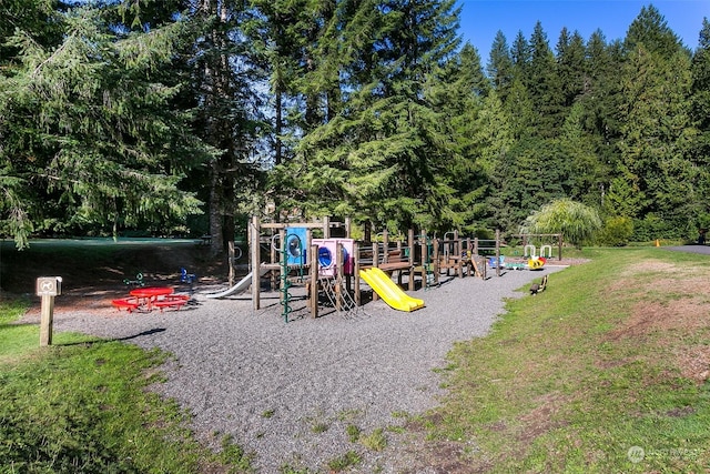 view of playground featuring a lawn