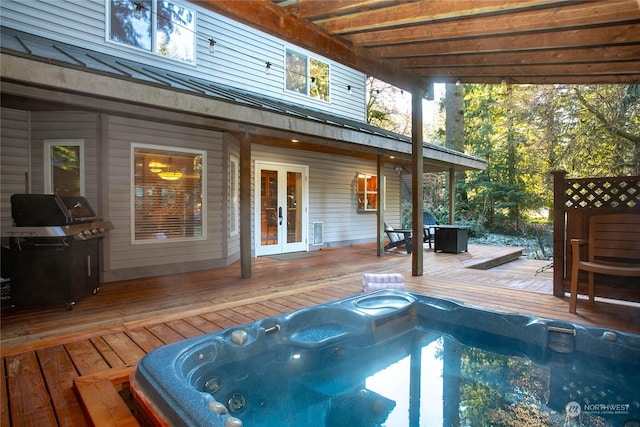 view of swimming pool with a wooden deck, area for grilling, and french doors