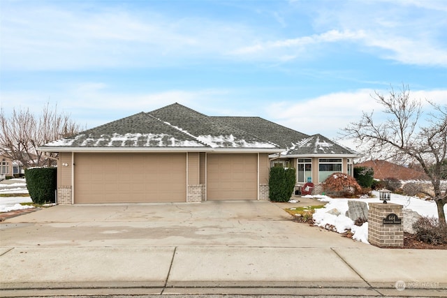 single story home featuring a garage