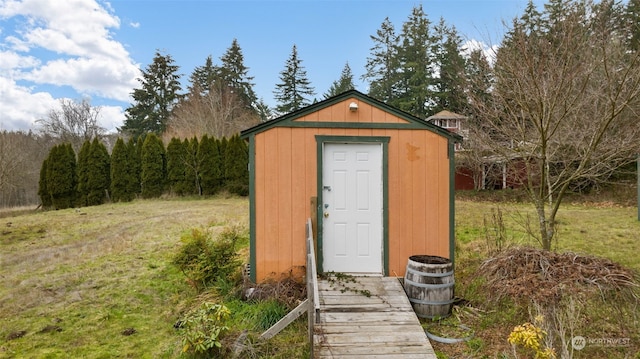 view of outdoor structure featuring a yard