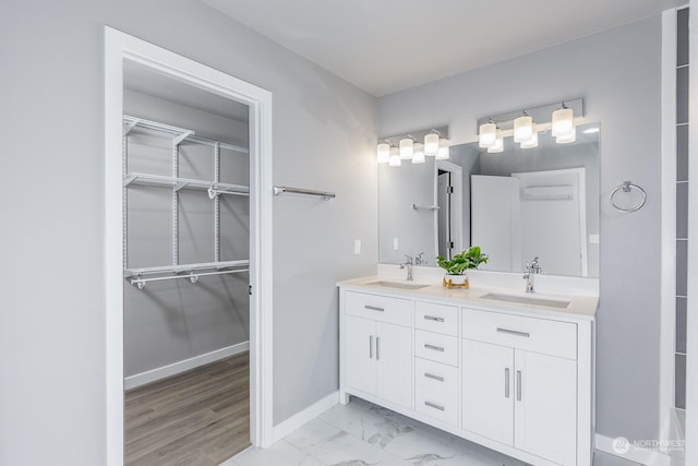 bathroom with a wall mounted AC and vanity