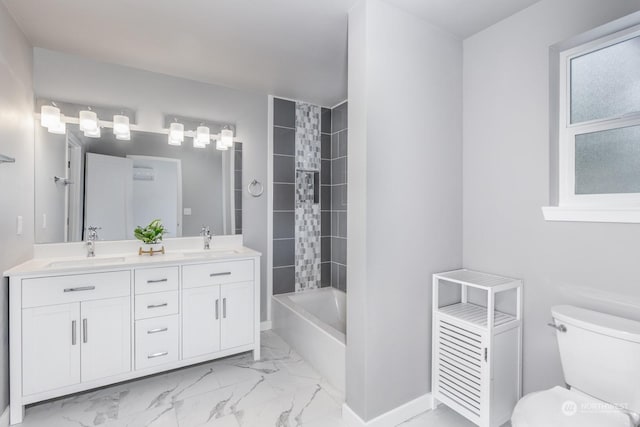 full bathroom with tiled shower / bath combo, toilet, and vanity