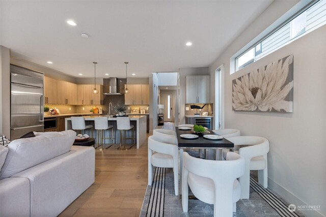 dining room featuring light hardwood / wood-style floors and sink