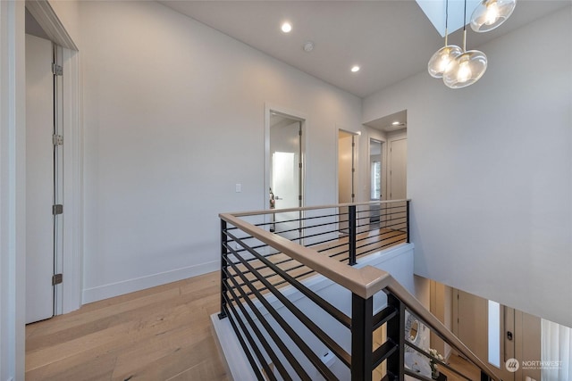 hall with light hardwood / wood-style flooring