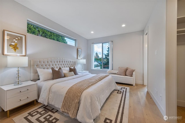 bedroom with light hardwood / wood-style floors