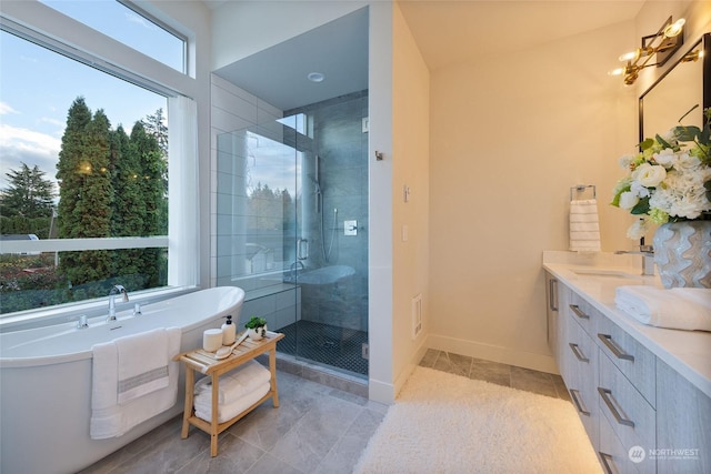 bathroom featuring tile patterned flooring, vanity, and independent shower and bath