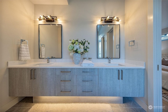 bathroom with tile patterned flooring and vanity