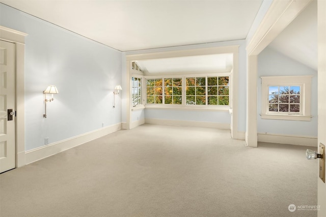 unfurnished room with light carpet