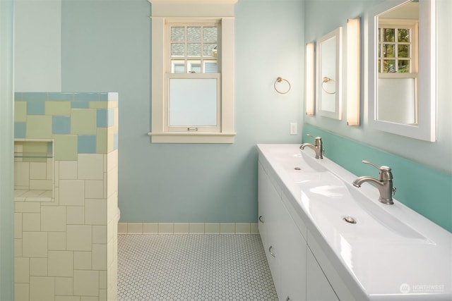 bathroom with tile patterned flooring and vanity