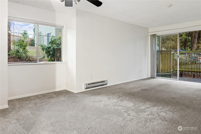 unfurnished room featuring carpet, ceiling fan, and baseboard heating