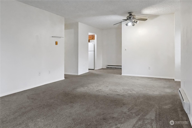 carpeted empty room featuring ceiling fan, a textured ceiling, and a baseboard heating unit