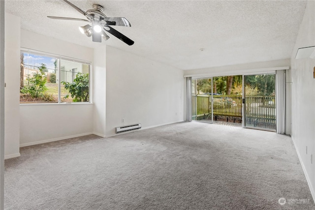 carpeted spare room with ceiling fan, a textured ceiling, and a baseboard radiator