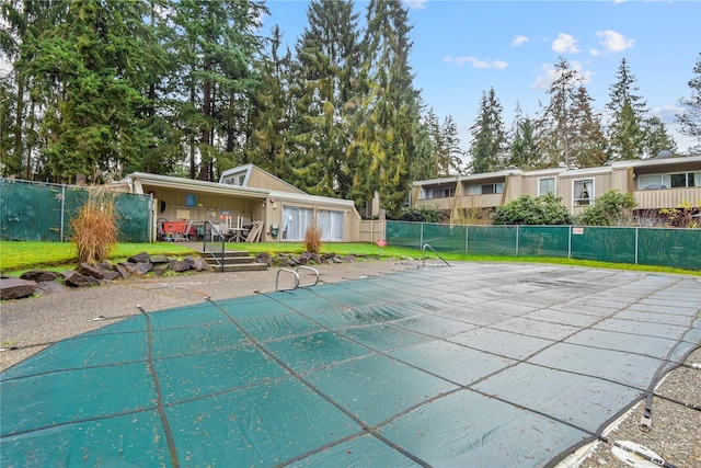 view of swimming pool with a patio area