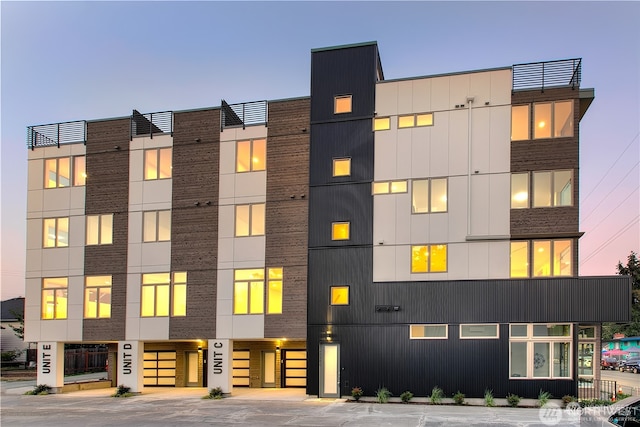 view of outdoor building at dusk