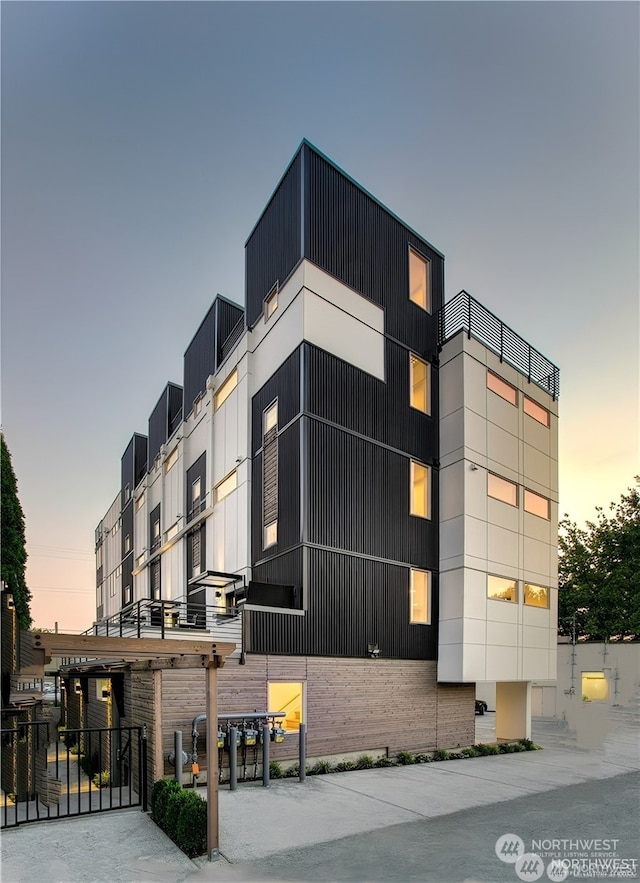 view of outdoor building at dusk