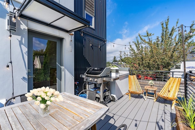 wooden deck featuring grilling area