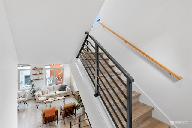 staircase with hardwood / wood-style flooring