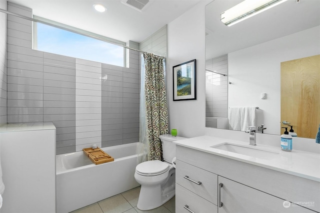 full bathroom with tile patterned floors, vanity, toilet, and shower / bathtub combination with curtain