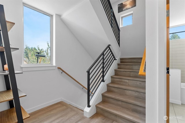 stairway featuring hardwood / wood-style floors