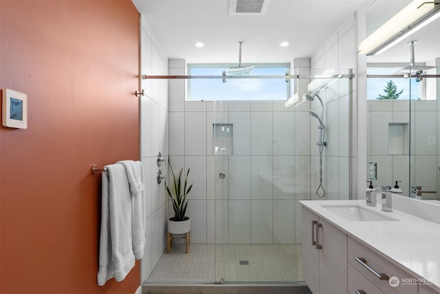 bathroom with vanity and walk in shower