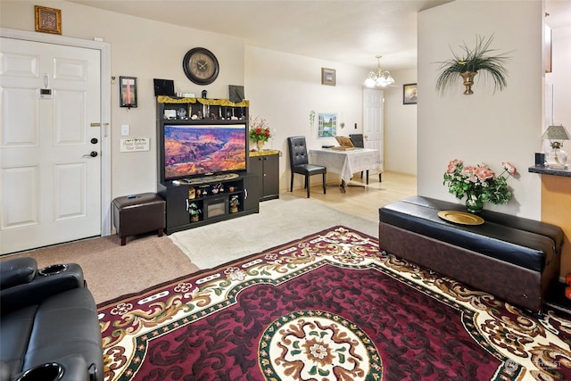 living room with a notable chandelier and light carpet