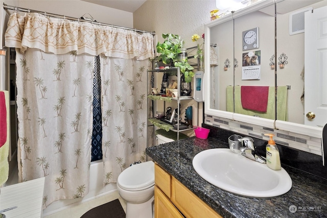 full bathroom featuring toilet, tile patterned flooring, tasteful backsplash, shower / tub combo, and vanity