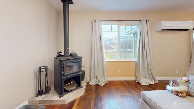 living room featuring a wall unit AC, a wood stove, and dark hardwood / wood-style flooring