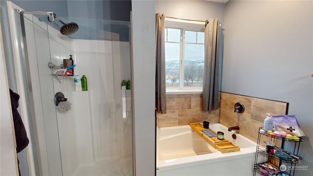 bathroom featuring plus walk in shower and a mountain view