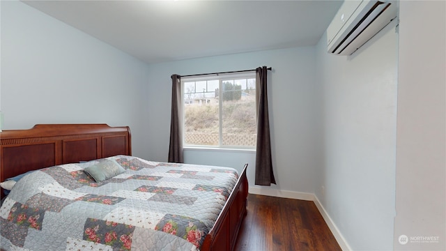 bedroom featuring dark hardwood / wood-style floors and a wall mounted AC