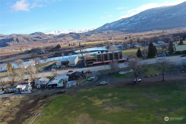 bird's eye view featuring a water and mountain view