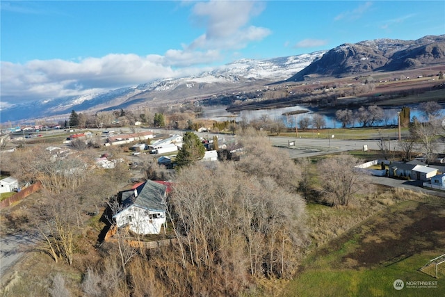 bird's eye view featuring a water and mountain view