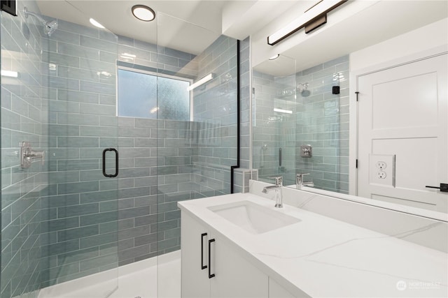 bathroom with vanity and an enclosed shower