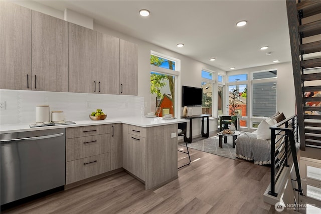 922B N 35th St, Seattle, WA 98103 - kitchen featuring stainless steel dishwasher, modern cabinets, light wood-type flooring, and recessed lighting