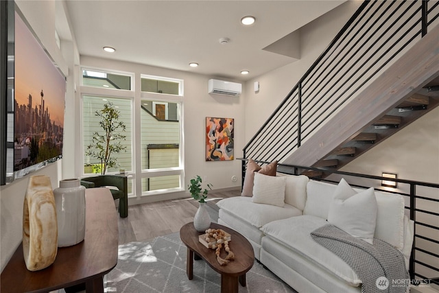 922B N 35th St, Seattle, WA 98103 - living area featuring an AC wall unit, wood finished floors, recessed lighting, and stairway