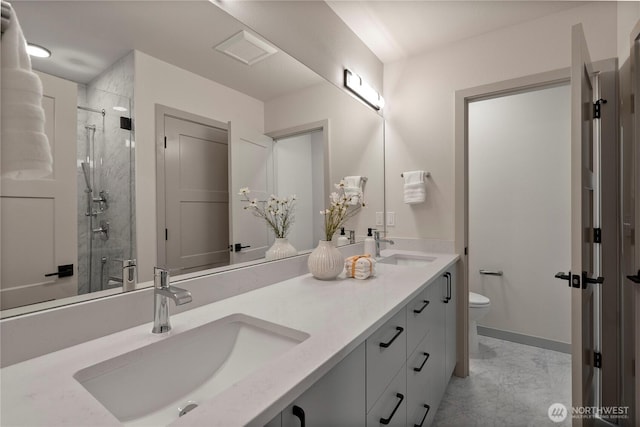 922B N 35th St, Seattle, WA 98103 - full bathroom featuring double vanity, a stall shower, and marble look tiles