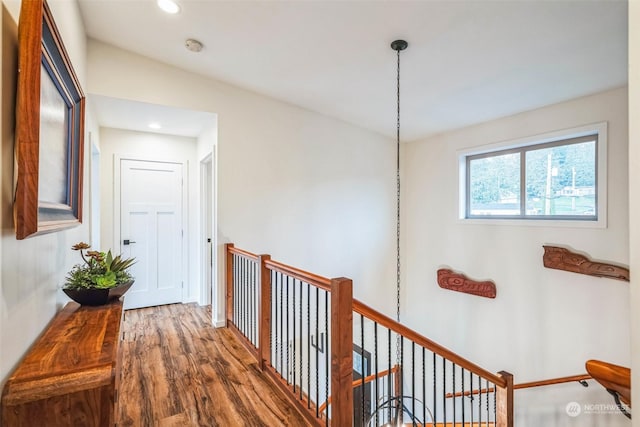 hall with hardwood / wood-style flooring