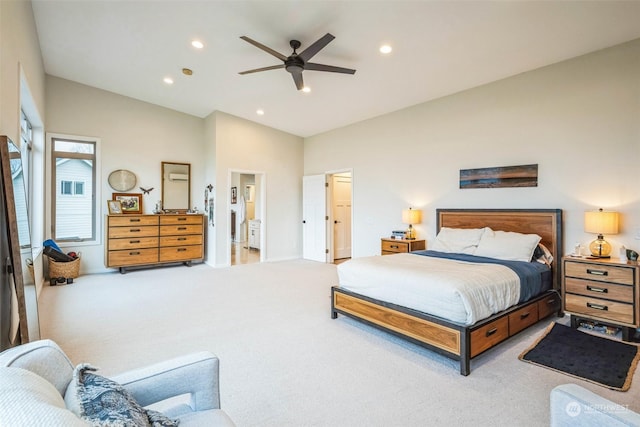 carpeted bedroom featuring ceiling fan and vaulted ceiling