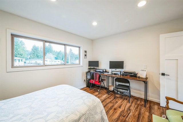 bedroom with hardwood / wood-style flooring