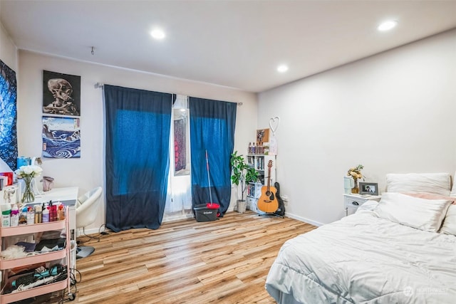 bedroom with wood-type flooring