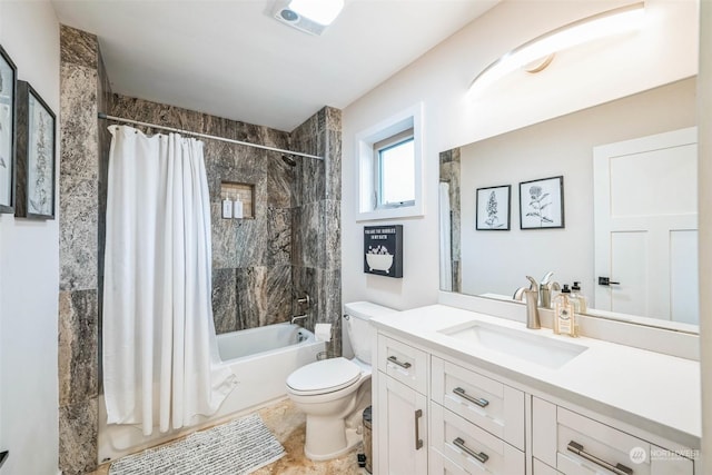 full bathroom with toilet, vanity, and shower / bath combo