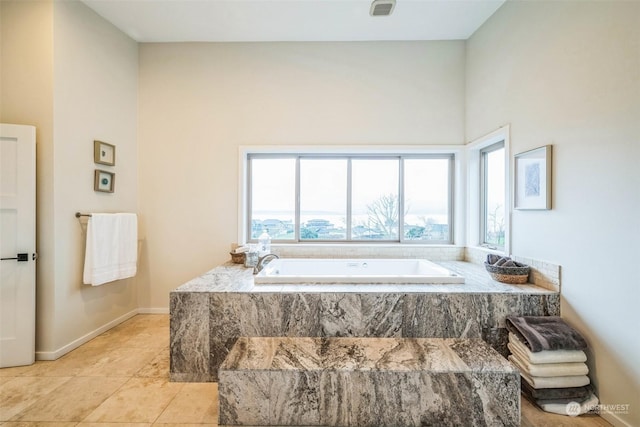 bathroom featuring tiled bath