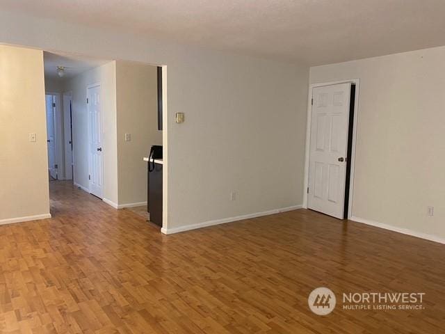 spare room featuring hardwood / wood-style floors