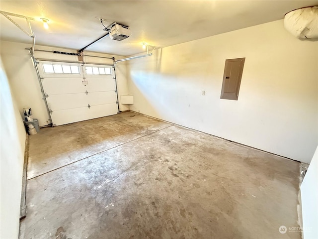 garage featuring electric panel and a garage door opener