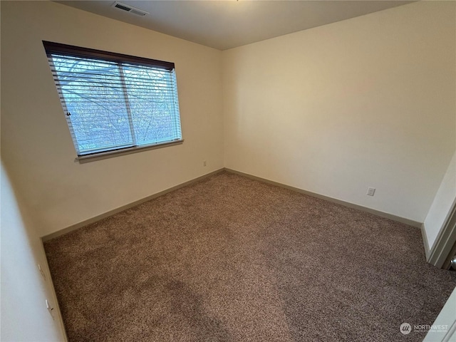 spare room featuring carpet flooring