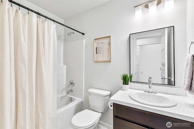 full bathroom featuring vanity, toilet, and shower / tub combo with curtain