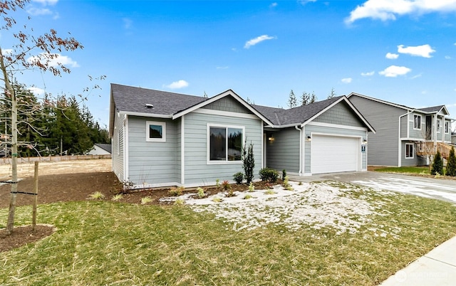 view of front of property with a shingled roof, a front yard, concrete driveway, and a garage