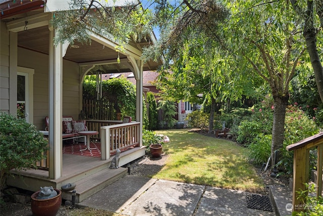 view of yard with covered porch