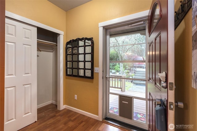 doorway to outside with dark hardwood / wood-style floors