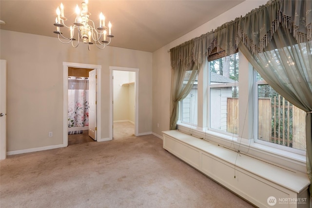 unfurnished dining area with light carpet and a chandelier