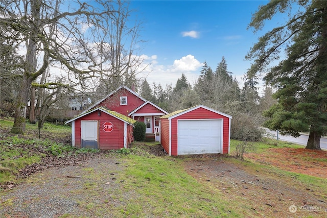 view of front of home featuring an outbuilding and a garage